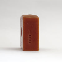 Side view of an unwrapped bar of Ylang Ylang Bar Soap