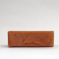 Top view detail of an unwrapped bar of TONIC Ylang Ylang soap