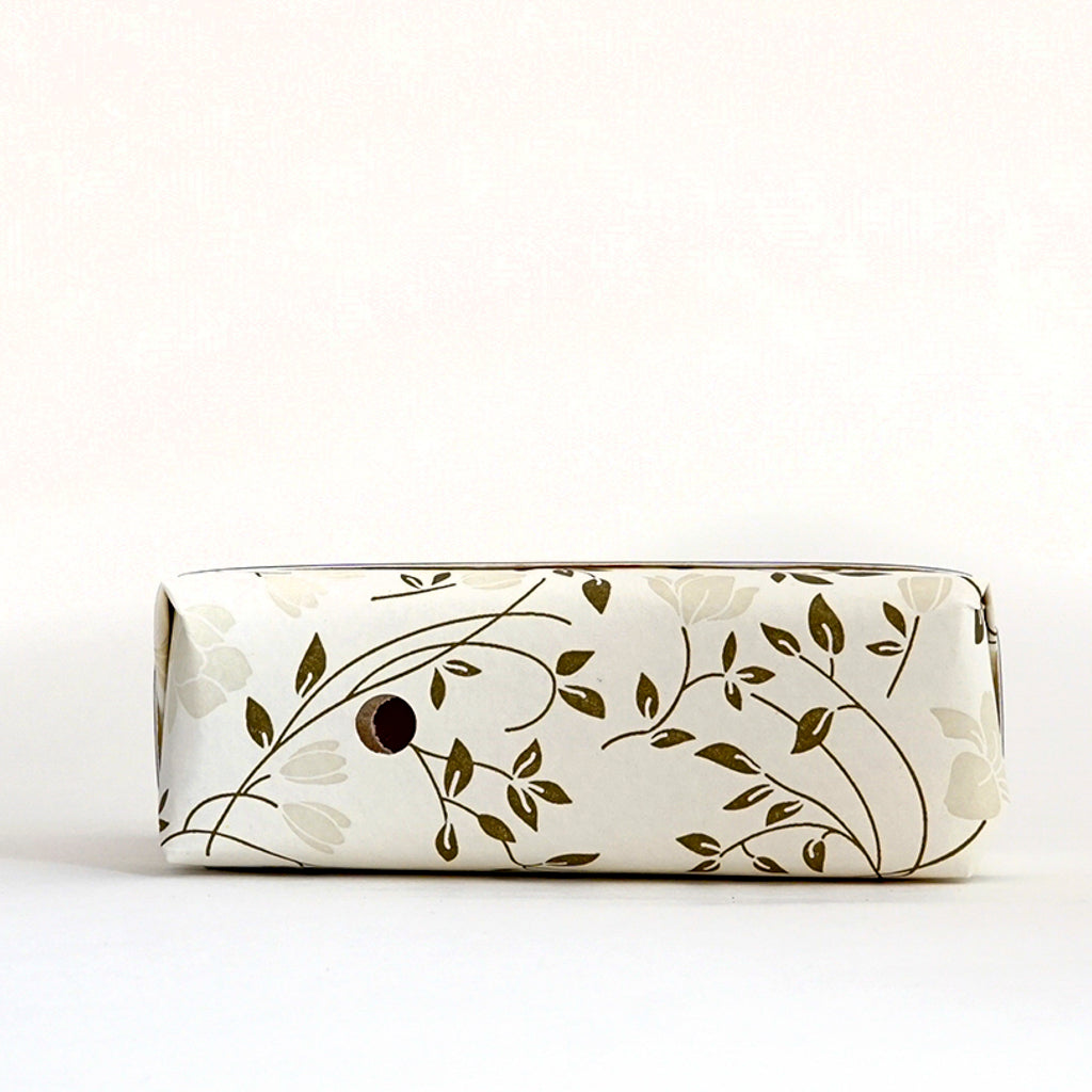 Top view detail of a wrapped bar of TONIC Ylang Ylang soap
