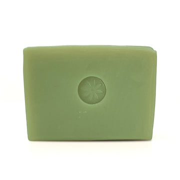 Neroli bar soap, unwrapped on a white background