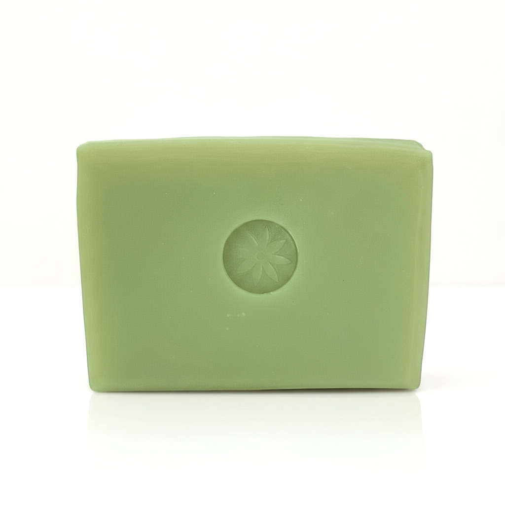 A bright green Neroli soap bar unwrapped on a white background