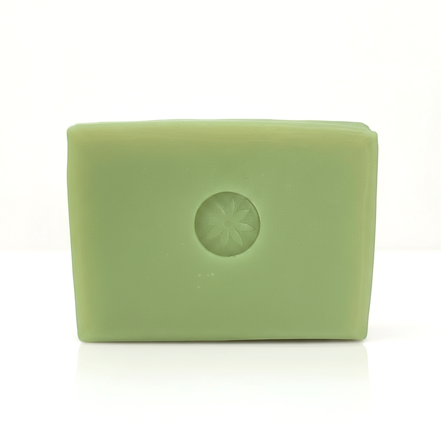 A bright green Neroli soap bar unwrapped on a white background