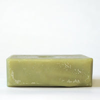 Top view of an unwrapped bar of Tonic Natural's Avocado bar soap.