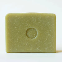 Front view of an unwrppaed bar of TONIC Avocado Bar Soap