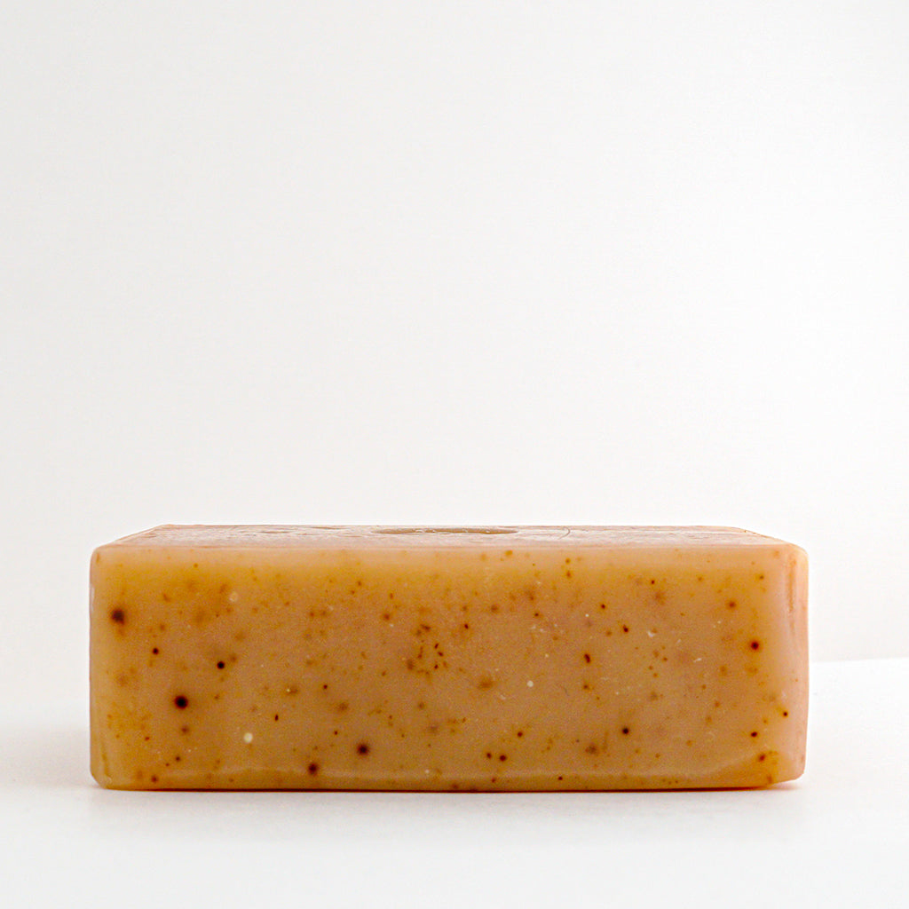 Top view of an unwrapped bar of Honey Lavender Bar Soap