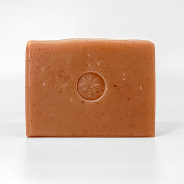 Cedar Sandalwood Bar Soap, unwrapped on an off white background