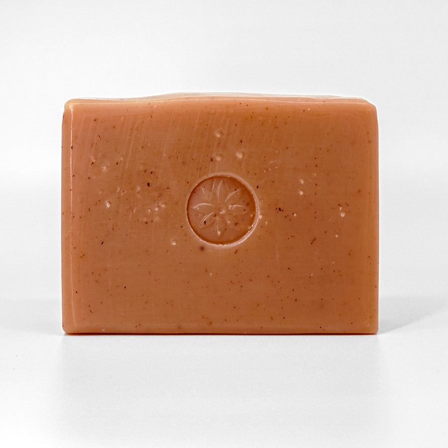 Cedar Sandalwood Bar Soap, unwrapped on an off white background