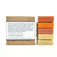 Citrus Collection Soap Sampler Box and a a stack of unwrapped soaps.