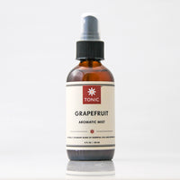 Grapefruit Essential Oil Aromatic Room Mist in amber glass bottle with black pump