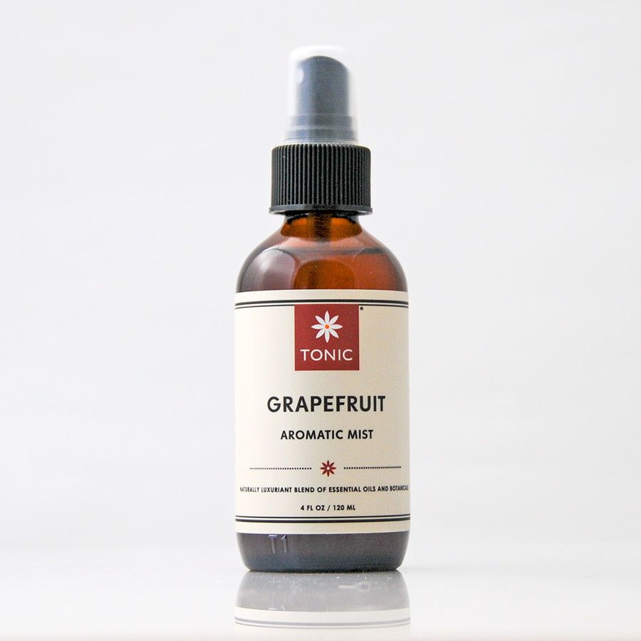 Grapefruit Essential Oil Aromatic Room Mist in amber glass bottle with black pump