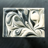 TONIC | Unwrapped Jasmine Sambac Bar Soap on a dark slate background