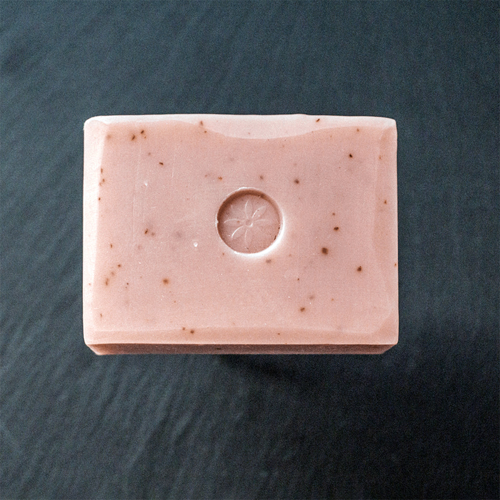 Tonic Naturals Rose Geranium Bar Soap on a slate background.