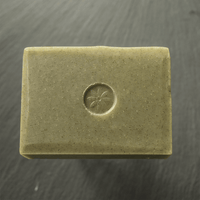 Mint Bar Soap by TONIC, unwrapped on a slate background