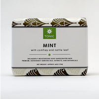 A wrapped bar of TONIC Mint Bar Soap with Comfrey and Nettle Leaf